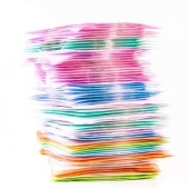 CD and its various colors in a flat container